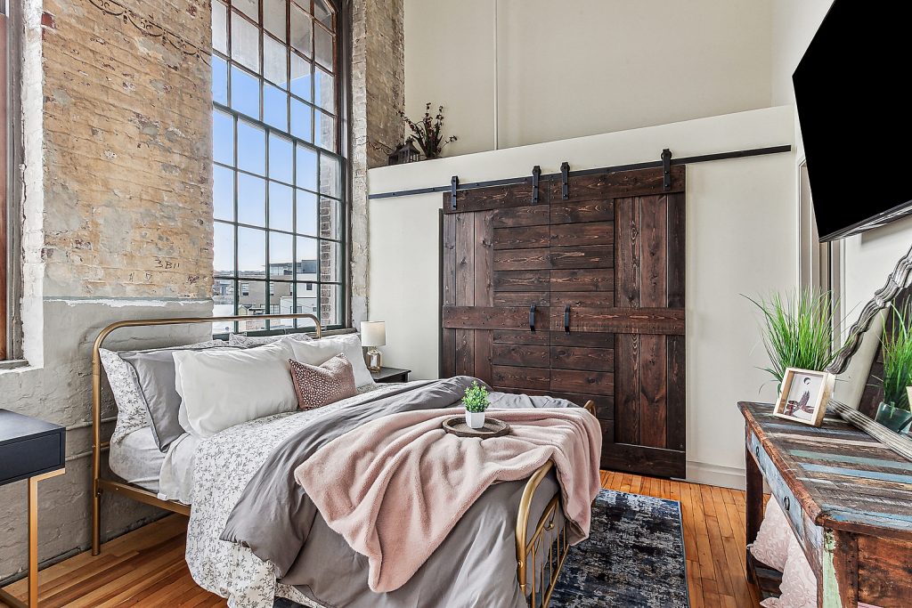 Bedroom with views of GNO bridge New Orleans mid term rental