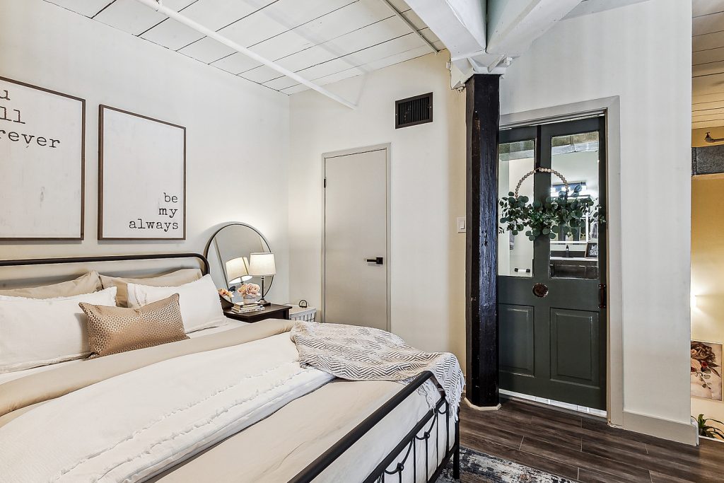 Cozy loft bedroom Cotton Mill furnished condo New Orleans